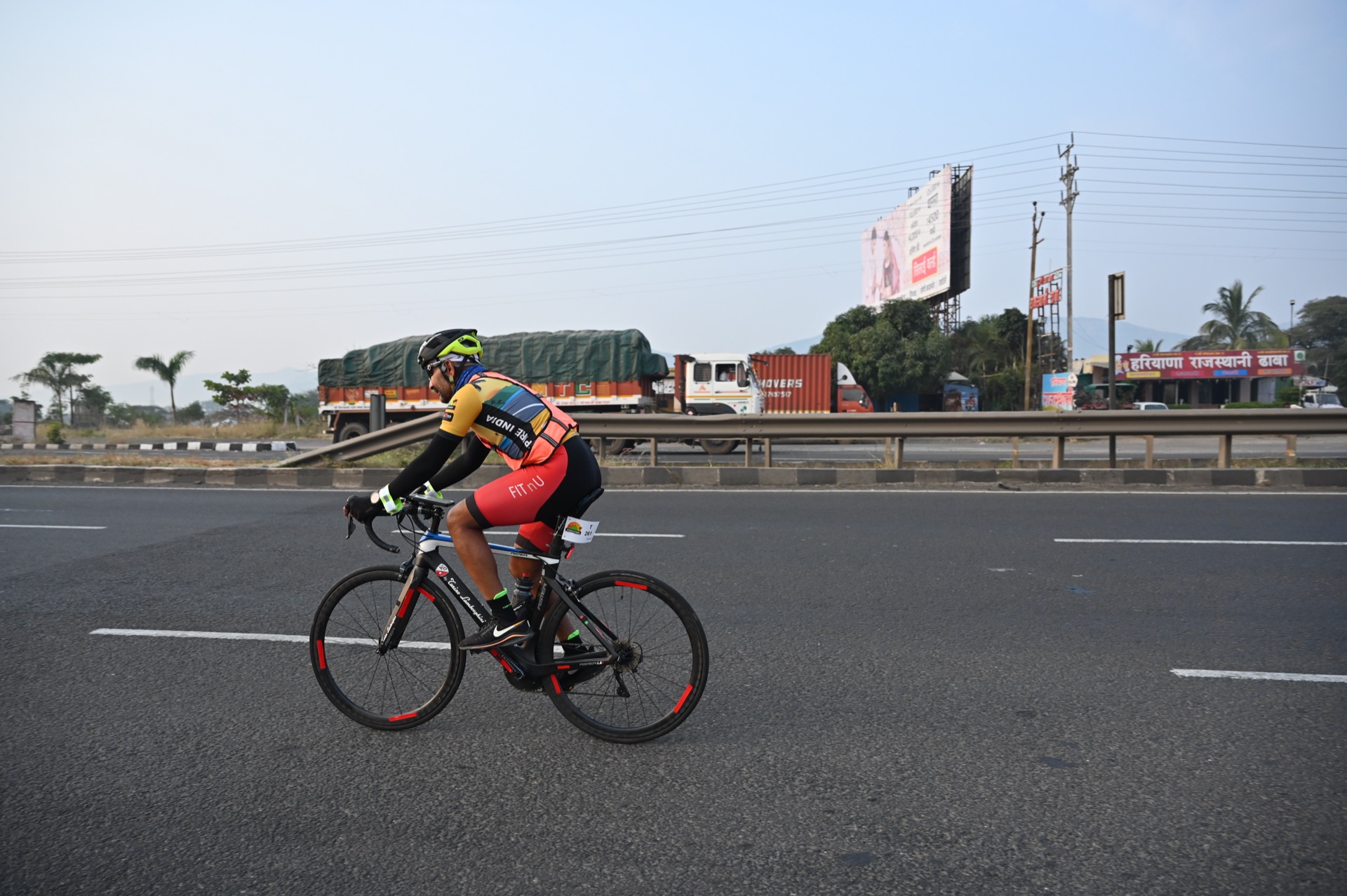 Sudhakar Reddy Gade cycling solo on a highway — the discipline that informs the coaching